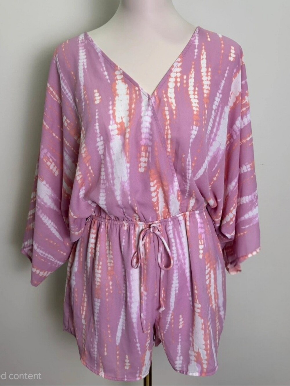 Peach Love California Pink and orange Tie-Dye Romper.